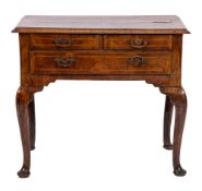 An early 18th Century walnut and cross and feather banded lowboy:,