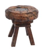 A circular rustic stool, being the cap of the Old Clock Tower, Ottery St Mary Church:,