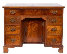 A late 19th Century mahogany and inlaid kneehole desk:,