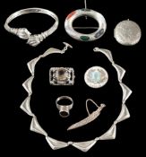 A small group of silver jewellery: to include: a silver locket, engraved with foliage,
