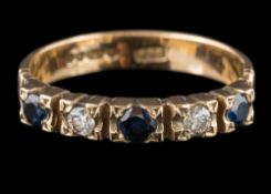 A 9 carat gold, blue and white stone-set half hoop ring: ring size P 1/2.