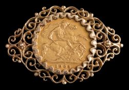 A half sovereign dated 1903 mounted in a 9ct gold frame as a brooch: approximately 7.8gms.