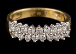 An 18 carat gold and diamond two-row cluster ring: set with round,