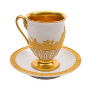 A Meissen Empire white and gilt cabinet cup and saucer: in neo-classical style,