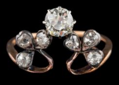 A diamond clover leaf ring: the old brilliant cut diamond estimated to weigh 0.