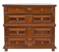 A late 17th Century oak rectangular chest in two parts in the Jacobean taste:, with a moulded top,