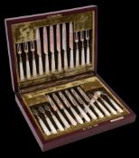 A set of twelve Edward VII silver and mother of pearl handled dessert knives and twelve forks,
