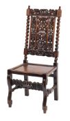 A 19th Century carved oak dining chair in the Carolean taste:,