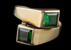 A green tourmaline two-stone crossover ring: the shank stamped '585' approximately 4gms gross