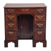 A mid 18th Century mahogany kneehole desk of small size:,