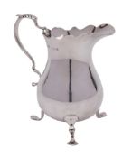 A George V silver cream jug, maker A Marston & Co, Birmingham, 1930: of baluster form,