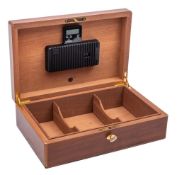 A Dunhill walnut humidor: of plain rectangular outline the hinged lid enclosing three fitted