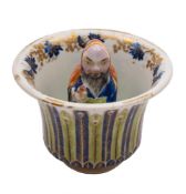 A Chinese famille rose 'trick' cup: the interior with a figure of the Immortal Han Zhongli and a