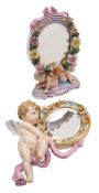 A small Meissen hanging mirror: in the form of a cherub and drapery supporting an oval flower