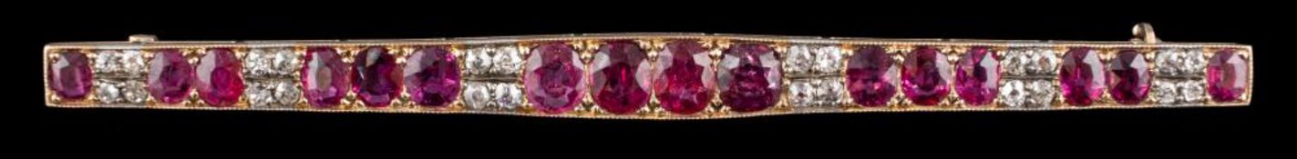 A ruby and diamond brooch: the tapered panel set with oval cut rubies and old cut diamonds,