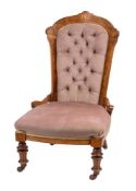 A Victorian walnut and inlaid nursing chair:,