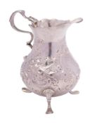 A George III silver cream jug, maker Walter Brind, London, 1763: initialled,