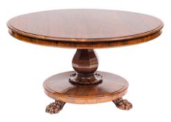 A William IV rosewood circular breakfast table:, the snap top with a moulded edge,