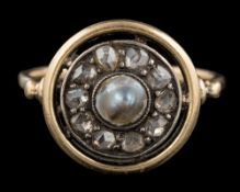 A 1920s pearl and diamond ring: the central half pearl within a surround of rose cut diamonds,