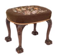A carved walnut oval stool in the George II manner:, with a stuff over seat,
