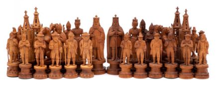 WITHDRAWN LOT A late 19th century finely carved Swiss linden wood figural chess set: one side