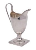 An Elizabeth II silver cream jug, maker K M Silver, Birmingham,