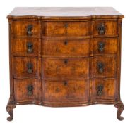 A walnut and cross and feather banded serpentine fronted chest in the 18th Century manner:,