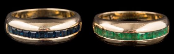 A calibre-cut emerald half-hoop ring: stamped '585' together with a similar sapphire mounted ring:
