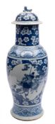 A Chinese blue and white baluster vase and cover: with kylin finial,