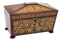 A Regency rosewood and brass inlaid tea caddy: of sarcophagus outline,