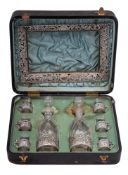 A late Victorian clear glass and silver mounted liqueur set, maker William Comyns & Sons, London,