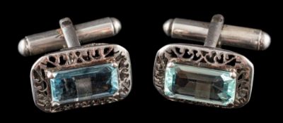 A pair of aquamarine mounted cufflinks: each with a rectangular aquamarine approximately 12.
