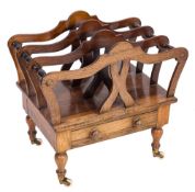 A Victorian rosewood three division canterbury:, with shaped and turned divisions,