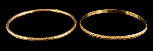 Two yellow metal bangles: one stamped '21C' the other with foreign markings, approximately 13.