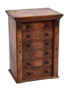 A Victorian walnut collector's Wellington chest:, fitted with six small drawers,