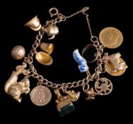 A 9ct gold curb-link bracelet: with attached half sovereign dated 1902 and various 9ct gold charms