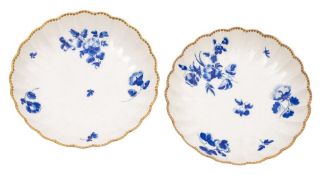 A pair of First Period Worcester fluted saucers: painted in 'dry blue' in the workshops of James