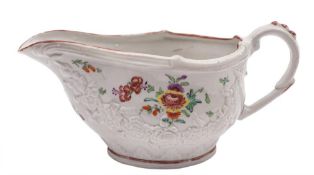 A Bristol [William Cookworthy] sauceboat: of oval silver shape moulded with floral swags between