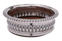 A silver wine coaster, all marks worn: crested,