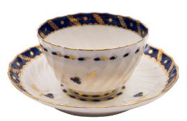 A Flight Worcester wrythen moulded teabowl and saucer and a similar Chamberlain's Worcester teabowl