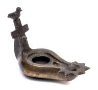 A Coptic bronze lamp,: of pear-shaped outline with geometric decoration to the rim,