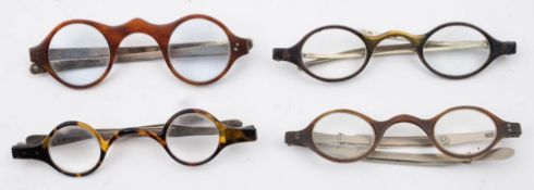 Four pairs of tortoiseshell and white metal spectacles: all having tortoiseshell mounted lenses