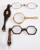 A pair of of tortoiseshell lorgnettes,