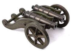 A late 19th century bronze double cannon: the two 6 1/4 inch five stage barrels with plain cascabel,