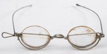 An unusual pair of 19th century steel half rim spectacles with half moon clip on reading lenses: