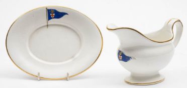 A Royal London Yacht Club earthenware sauce boat and stand by Bisto: with enamel pennant and gilt