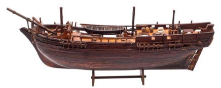 A cut away model of an 18th century Royal Navy Armed Vessel style ship: with simulated planked