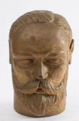 An early 20th century carved wooden bust of Edward VII: over painted in a gold colour, 17.5cm high.