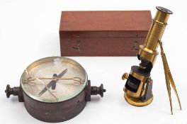 A small lacquered brass student microscope in mahogany case: together with a brass cased resistance