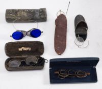 A pair of 19th century steel spectacles: with blue glass lenses and folding mesh side screens,
